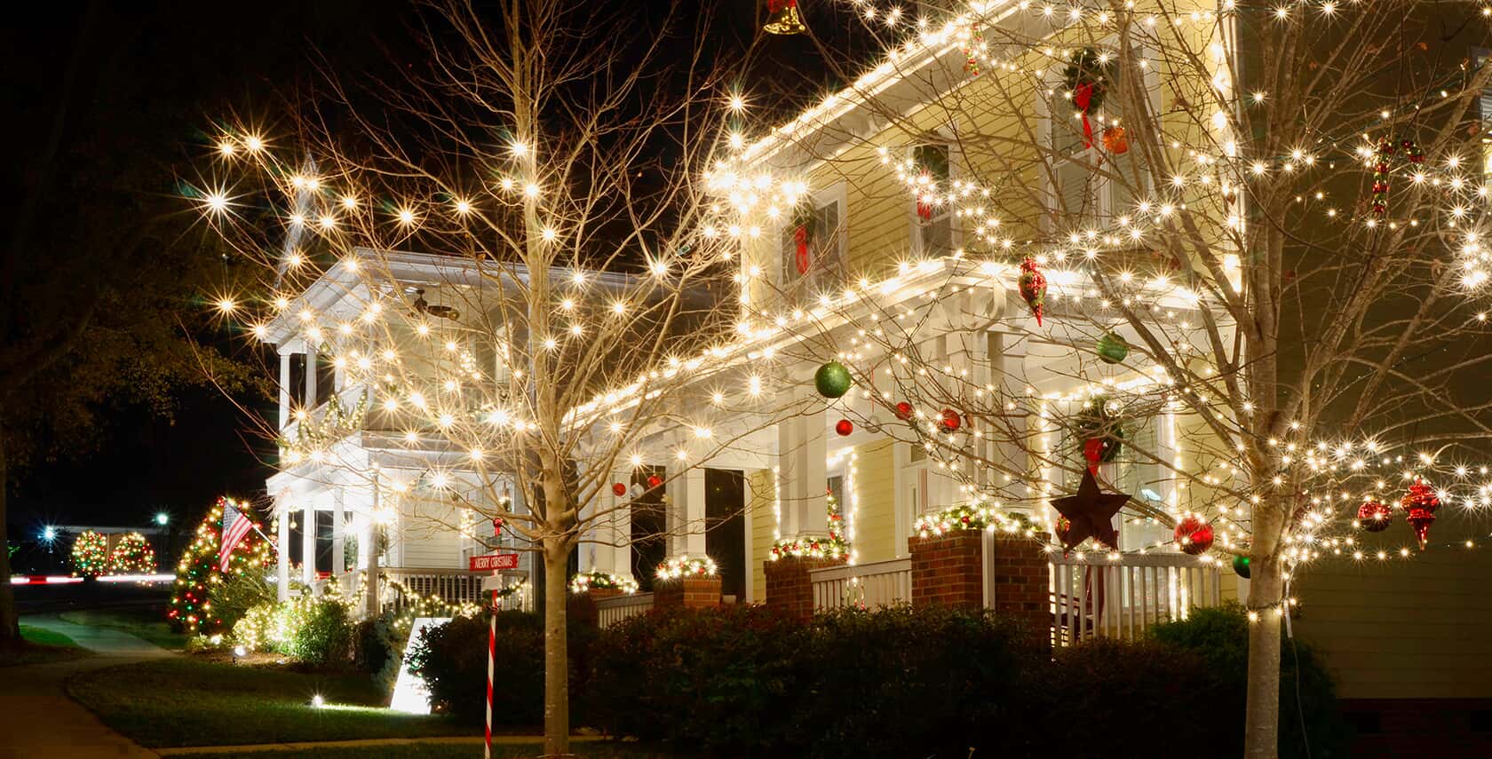 building with holiday lighting and tree lighting